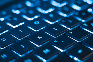 Illuminated keyboard closeup. Hi tech concept