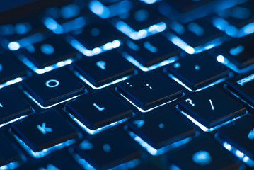 Illuminated keyboard closeup. Hi tech concept