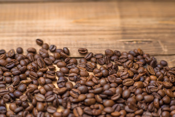 Coffee beans on wooden table