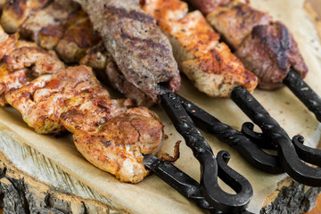 Barbecue meat. Grilled pork skewers on plate. selective focus. close up