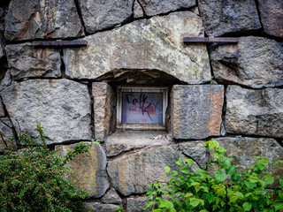 small window in stone house
