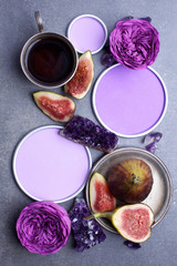 A mug of hot coffee, figs and flowers. A cosy evening. Spring, Autumn. Top view