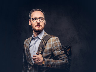 Traveler. Studio portrait of a handsome bearded man wearing a ca
