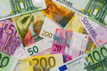 euro and Swiss franc monmey as background