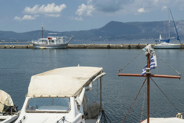 Fototapeta na wymiar Harbor and bay with fishing boats and yachts at Corfu, Greece