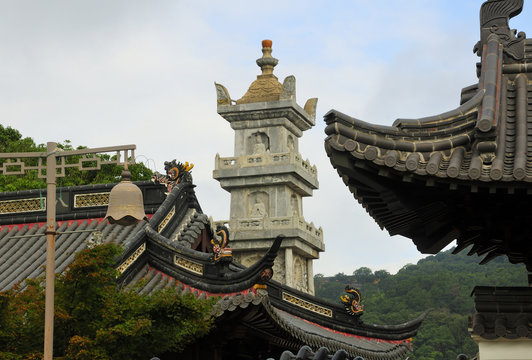 Various Chinese buildings and architecture near the multi treasure pagoda in the puji temple scenic area on the island of Putuoshan China in Zhejiang Province.