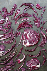 Arrangement of colorful red cabbage on slate table