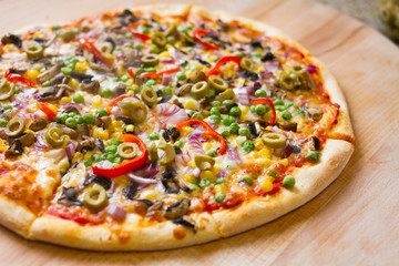 delicious vegetarian pizza on wood