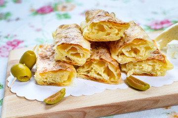 Homemade cheese pie. Cheese pie prepared in the traditional way, domestic white cheese and olives.