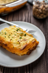 Shepherd's pie on a wooden background