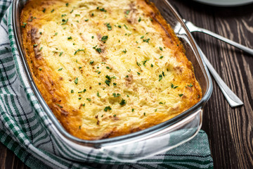 Shepherd's pie on a wooden background