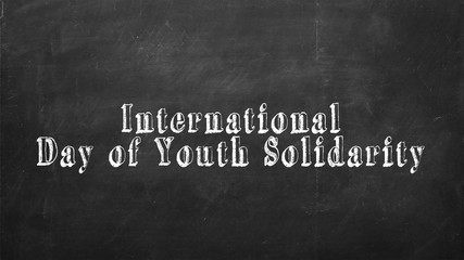 Text on blackboard: international day of youth solidarity