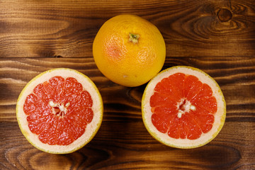 Ripe fresh grapefruits on wooden table