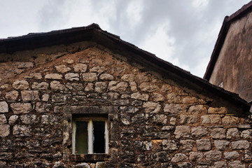 Facade of old building under gloomy sky
