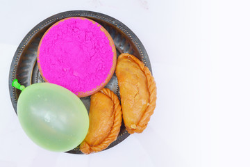 Holi sweet dish gujiya with holi colors