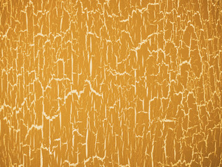 Texture of cracked old paint on an old stool in yellow