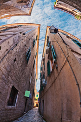 Fish-eye view of the old city on sky background