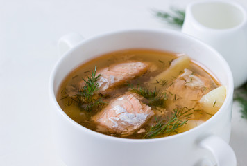 Salmon soup in a saucepan.
