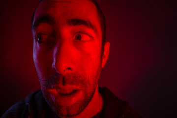 Man with shocked facial expression looking a side