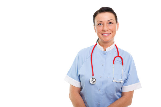 Portrait of Smiling brunette 35-40 years old woman in blue nurse uniform with Stethoscope on isolated white background. Health Care concept