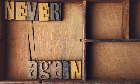 Never Again in wooden typeset letterpress
