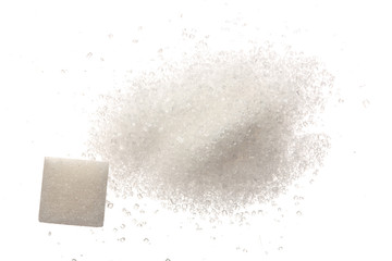 Heap of granulated sugar with cube isolated on white background. Top view. Flat lay