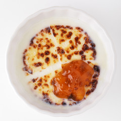 Cheese in milk with cloudberry jam
