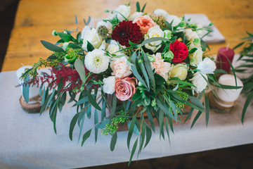 Table flower bouquet decoration with candles