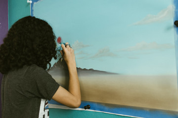 Young artist painting