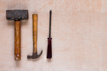 Hammers and other tools on a wooden table