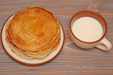 food, pancakes on a plate of milk and honey