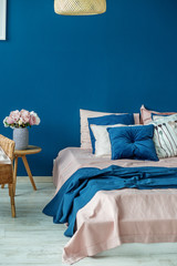 Big bed in the blue room. Concept interior, room, home, bedroom.