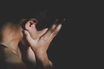 Young depressed woman, domestic and rape violence,beaten and raped sitting in the corner