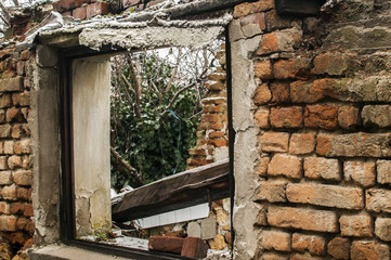 Grunge window frame of poor abandoned dirty demolished house closeup