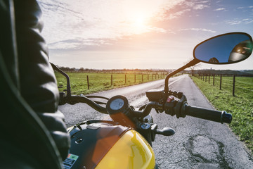 motorbike on the road riding. having fun riding the empty road on a motorcycle tour / journey