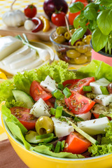 Greek salad with feta and tasty selection of vegetables.
