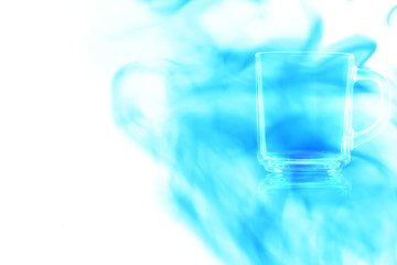 Empty glass mug enveloped in blue smoke.