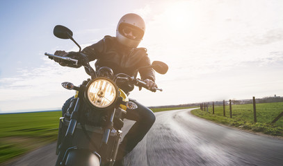 motorbike on the road riding. having fun riding the empty road on a motorcycle tour / journey
