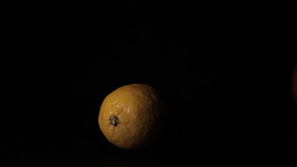 Lemon, black background.