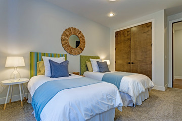 Adorable bedroom with a pair of twin beds