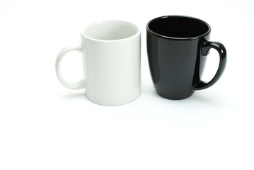 1 black 1 white coffee mugs side by side, high key, room for text