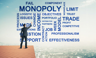 Young businessman standing on house roof and writing leadership 