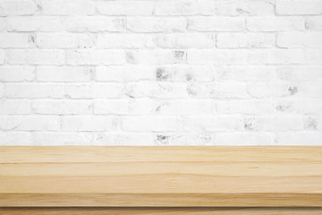 Empty wooden table over grunge cement wall background