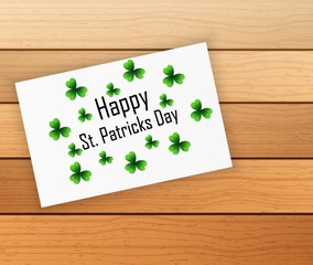 Saint Patrick's day card with shamrock leaves on white paper