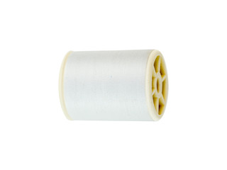 White spools of thread for sewing and embroidery.