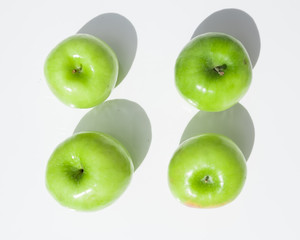 top view of four green Granny Smith apples