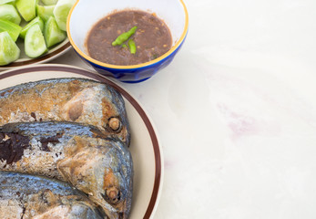 Fried mackerel with chili sauce and cucumber