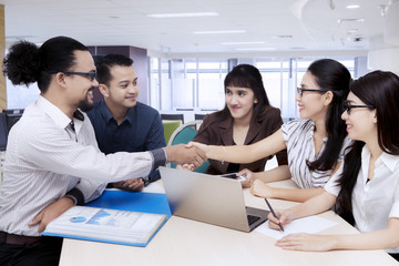 Group of business people come to an agreement during meeting