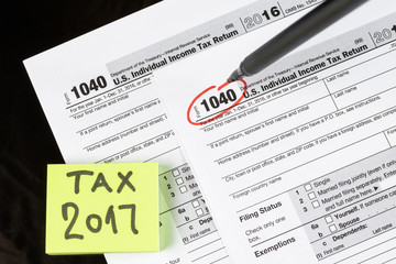Obraz premium Form 1040 Individual Income Tax return form. United States Tax forms 2016/2017. American blank tax forms. Tax time.