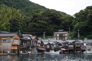 Fototapeta na wymiar Ancient Fisherman Village on a cloudy day at Ine Boathouse of Kyoto, JAPAN.